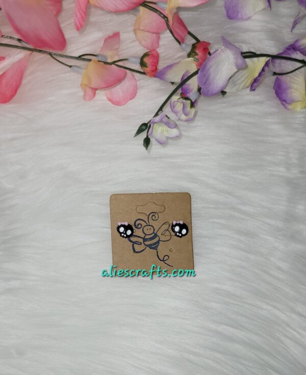 Punk skull with pink bow earrings