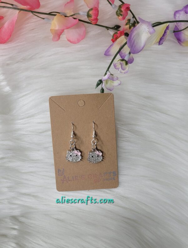 Hello kitty pink bow charm earrings