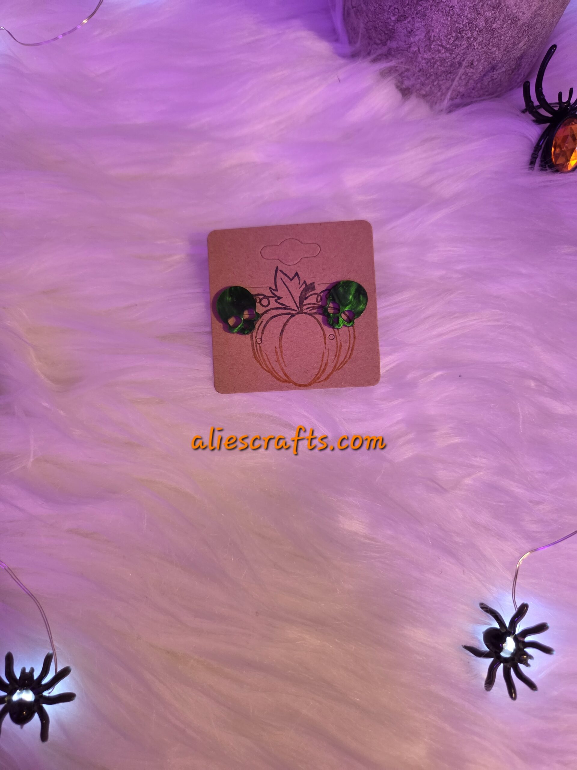 Green skull earrings