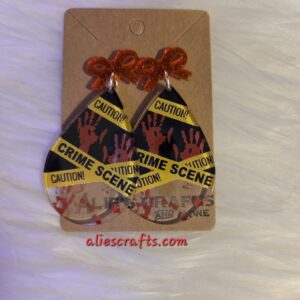 Crime scene earrings with red bows