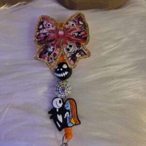 Jack and sally bow badge reel