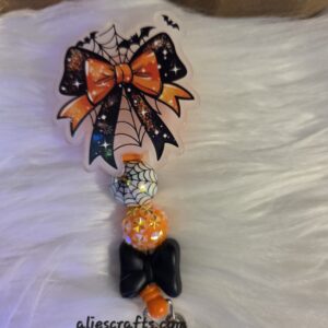 Glow in the dark bow badge reel