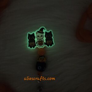 Glow in the dark Halloween cats badge