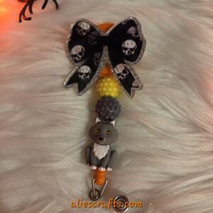 Black bow with skulls badge