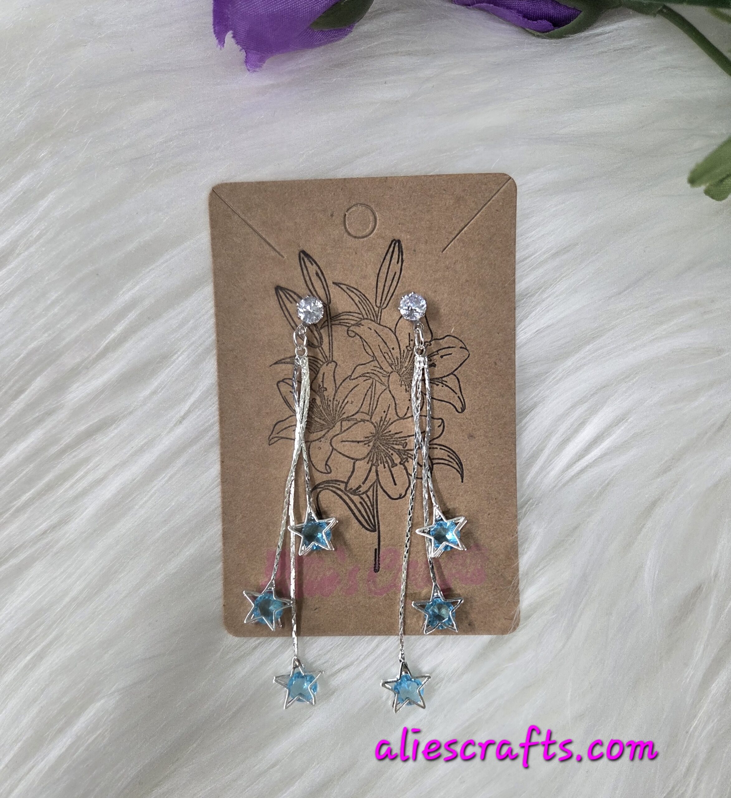 Blue star dangle earrings