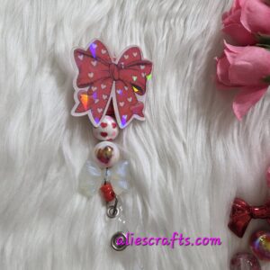 20260104_202103 Red bow holographic badge reel