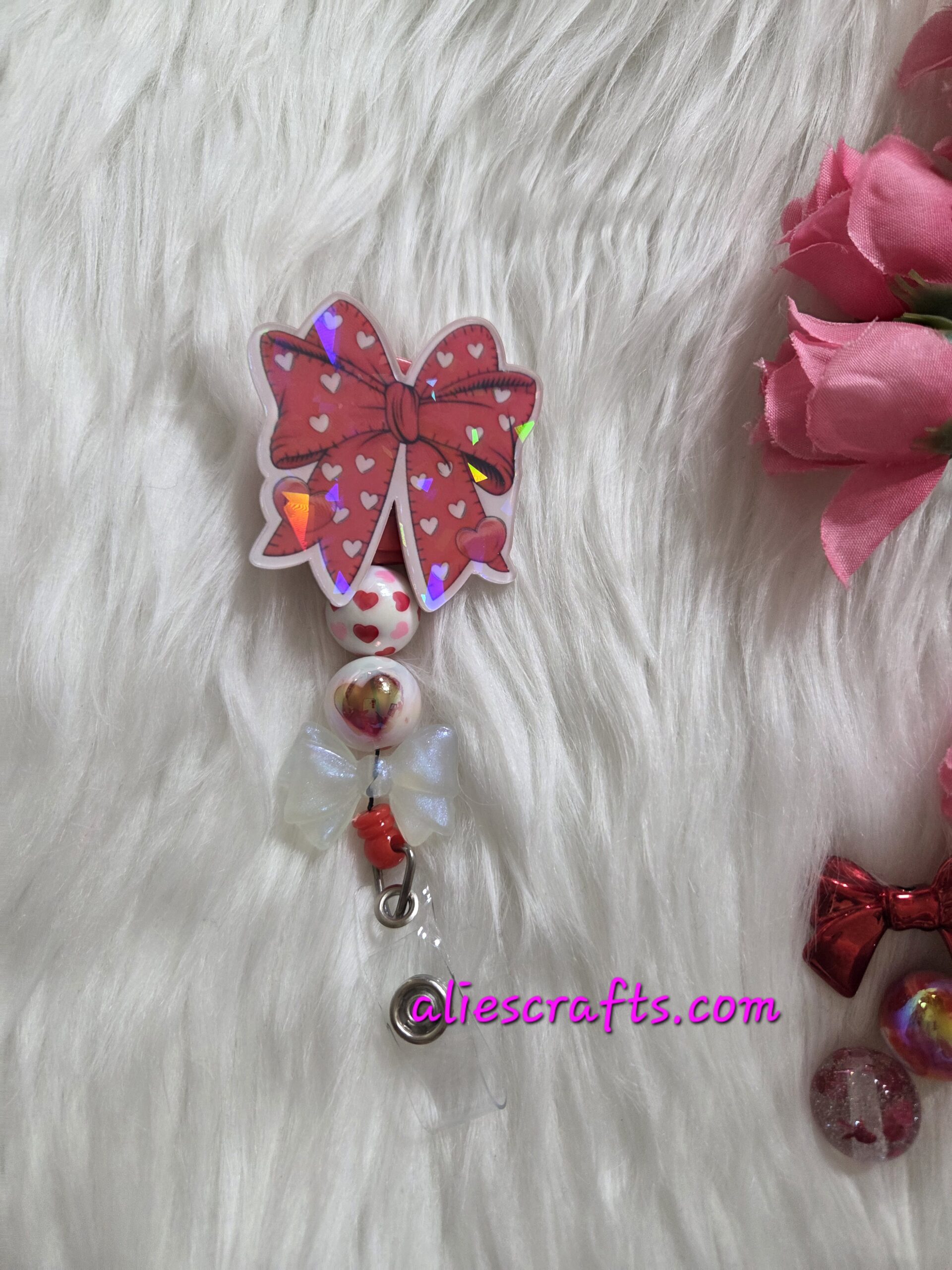Red bow holographic badge reel