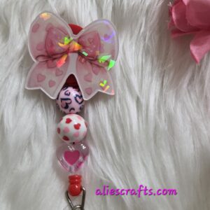 20260104_202530 Holographic pink bow badge